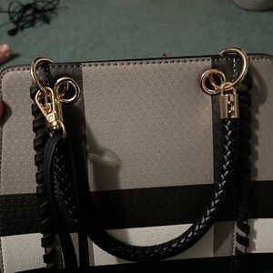 cute purse and cute design. has a good amount of room in it too!